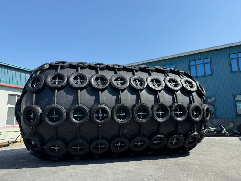 Pneumatic Yokohama-type rubber fender floating between a ship and dock