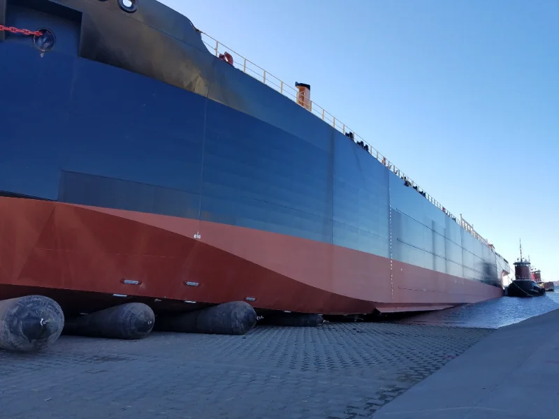 Ship launching airbags rolling a vessel down a slipway