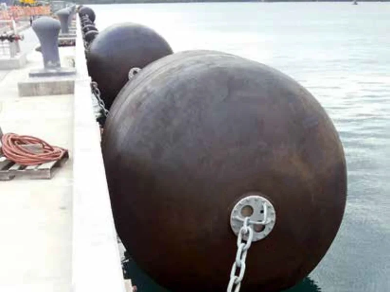 Sling type pneumatic rubber fender showing the end flange, lifting eye and sling arrangement used for STS berthing